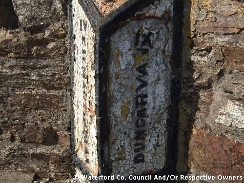 Milestone. Co Waterford. Displaying Kilmacthomas IV[4] miles and Dungarvan IX[9] miles. close up right side